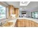 Bright kitchen features stainless steel appliances, skylight, and eat-in bar area, creating a functional and bright space at 1363 Cottage Grove Rd, Tarpon Springs, FL 34689