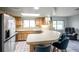 Bright kitchen features stainless steel appliances, skylight, and eat-in bar area, creating a functional and bright space at 1363 Cottage Grove Rd, Tarpon Springs, FL 34689