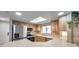 Well-lit kitchen featuring stainless steel appliances, skylight, and ample counter space for cooking and meal preparation at 1363 Cottage Grove Rd, Tarpon Springs, FL 34689