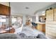 Comfortable living room integrates the kitchen, dining, and office areas, creating an open and inclusive atmosphere at 1363 Cottage Grove Rd, Tarpon Springs, FL 34689