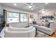 Cozy living room with large windows, plush seating, and stylish decor creates a relaxing and inviting atmosphere at 1363 Cottage Grove Rd, Tarpon Springs, FL 34689