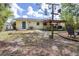 The well-maintained backyard features a covered patio, perfect for grilling and relaxation at 153 Alpine Ct, Bradenton, FL 34208