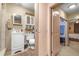 Clean bathroom featuring a toilet, sink, shower, and open access to an adjacent room at 153 Alpine Ct, Bradenton, FL 34208
