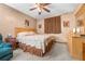 Cozy bedroom features a ceiling fan, natural light, and carpeted floors for added comfort at 153 Alpine Ct, Bradenton, FL 34208