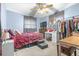 Comfortable bedroom featuring large windows, a study space, and a cozy seating area at 153 Alpine Ct, Bradenton, FL 34208
