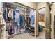 Well-organized walk-in closet offers ample storage space for clothing, shoes, and accessories at 153 Alpine Ct, Bradenton, FL 34208