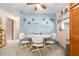 Cozy dining area with blue accent wall, and carpet with neutral decor at 153 Alpine Ct, Bradenton, FL 34208