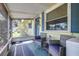 Inviting screened porch with comfortable seating, perfect for enjoying the outdoors at 153 Alpine Ct, Bradenton, FL 34208