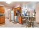 Inviting kitchen featuring a breakfast bar, wooden cabinets, and modern appliances for Gathering cooking at 153 Alpine Ct, Bradenton, FL 34208