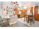Cozy kitchen featuring wooden cabinetry, tiled floors, and adjacent dining area with plenty of space at 153 Alpine Ct, Bradenton, FL 34208