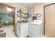 Well-equipped laundry room with washer, dryer, and ample storage, conveniently located near the dining area at 153 Alpine Ct, Bradenton, FL 34208