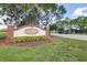 A welcoming Tom Bennett Park sign marks the community entrance with lush landscaping at 153 Alpine Ct, Bradenton, FL 34208