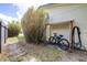 A practical side yard offers convenient storage for bikes and garden essentials at 153 Alpine Ct, Bradenton, FL 34208