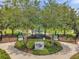 A shaded Bark Yard offers a secure space for pets to socialize and exercise, fostering a pet-friendly community at 18144 Frame Bnd, Land O Lakes, FL 34638