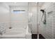 Modern bathroom with a large soaking tub, frameless glass shower, and contemporary fixtures at 18144 Frame Bnd, Land O Lakes, FL 34638