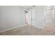 A spacious bedroom offers a neutral color palette and carpeted floors at 18144 Frame Bnd, Land O Lakes, FL 34638