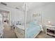 Bedroom features a four poster bed, princess artwork, and a miniature kitchen set at 18144 Frame Bnd, Land O Lakes, FL 34638