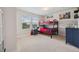Bright bedroom features a bunk bed, neutral carpet, and a large window with views of the outside at 18144 Frame Bnd, Land O Lakes, FL 34638