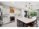 Stylish kitchen featuring a large island, modern appliances, and white cabinets at 18144 Frame Bnd, Land O Lakes, FL 34638