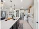 Beautiful kitchen featuring stainless steel appliances, a large island, and modern pendant lighting at 18144 Frame Bnd, Land O Lakes, FL 34638