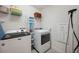 Well-organized laundry room features modern appliances and plenty of storage for all your needs at 18144 Frame Bnd, Land O Lakes, FL 34638