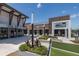 Landscaped pedestrian area in a shopping center featuring a variety of eateries and retail stores at 18144 Frame Bnd, Land O Lakes, FL 34638