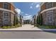Street view of a town center walkway lined with shops, restaurants, and landscaped planters at 18144 Frame Bnd, Land O Lakes, FL 34638