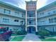 Beautiful condominium building with three levels and a uniquely decorated entryway at 2070 World Parkway Blvd # 36, Clearwater, FL 33763