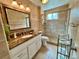 Well-lit bathroom featuring a large mirror and glass shower enclosure at 2070 World Parkway Blvd # 36, Clearwater, FL 33763