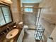 Bathroom with tile and glass shower enclosure at 2070 World Parkway Blvd # 36, Clearwater, FL 33763