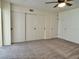 This bedroom features a ceiling fan and closet for storage at 2070 World Parkway Blvd # 36, Clearwater, FL 33763