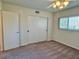 This bedroom features a ceiling fan, closet, and window at 2070 World Parkway Blvd # 36, Clearwater, FL 33763