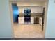 Bright kitchen with stainless steel appliances, granite countertops, and tile flooring at 2070 World Parkway Blvd # 36, Clearwater, FL 33763