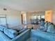 Bright living room area with a large mirror reflecting the adjacent dining space at 2070 World Parkway Blvd # 36, Clearwater, FL 33763
