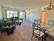 Comfortable living space with dining area, open floor plan, and balcony access at 2070 World Parkway Blvd # 36, Clearwater, FL 33763