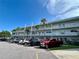 Apartment building exterior showcasing multiple parking spaces and a well-maintained facade at 2070 World Parkway Blvd # 36, Clearwater, FL 33763