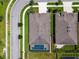 The roof, pool and backyard are viewed from above, demonstrating well maintained community landscaping at 21837 Briske Morning Ave, Land O Lakes, FL 34637