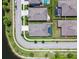 An aerial view of homes featuring backyard pools, neatly manicured lawns, and a serene neighborhood street layout at 21837 Briske Morning Ave, Land O Lakes, FL 34637