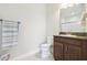 Compact bathroom featuring a single sink vanity with granite countertop and neutral-toned walls at 21837 Briske Morning Ave, Land O Lakes, FL 34637
