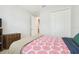 Bright bedroom with closet, white walls and modern bedspread at 21837 Briske Morning Ave, Land O Lakes, FL 34637