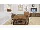 Elegant dining room with wood table, matching chairs, and decorative wall accents at 21837 Briske Morning Ave, Land O Lakes, FL 34637