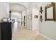 Elegant foyer featuring a herringbone tile floor, arched doorways and decorative shelving at 21837 Briske Morning Ave, Land O Lakes, FL 34637
