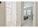 Hallway features doorways into bedroom and bathroom at 21837 Briske Morning Ave, Land O Lakes, FL 34637