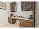 Gourmet kitchen with granite countertops, custom cabinets, and stainless steel fridge at 21837 Briske Morning Ave, Land O Lakes, FL 34637