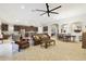 Open floor plan featuring a living room, dining area, and a kitchen with stainless steel appliances at 21837 Briske Morning Ave, Land O Lakes, FL 34637