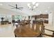 Spacious living room with open floor plan, designer tile, and natural lighting at 21837 Briske Morning Ave, Land O Lakes, FL 34637