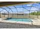 Relaxing screened in pool area with paved deck at 21837 Briske Morning Ave, Land O Lakes, FL 34637