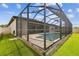 A screened in pool and spa are nestled into a paver patio at 21837 Briske Morning Ave, Land O Lakes, FL 34637