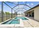 A screened-in pool area with a large pool and spa provides a great place to relax at 21837 Briske Morning Ave, Land O Lakes, FL 34637