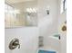 Bright shower with a built-in seat, handheld shower head, and a large, framed mirror at 21837 Briske Morning Ave, Land O Lakes, FL 34637